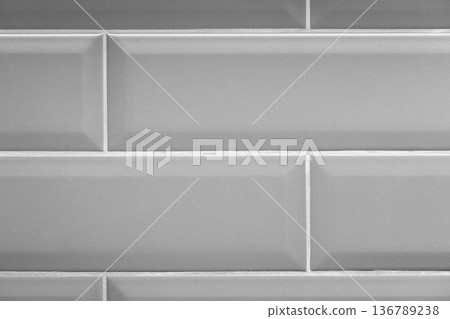 Minimal gray tile wall showing repeating ceramic tiles Minimal gray tile wall showing repeating ceramic tiles 136789238