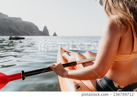 Woman Paddleboarding Ocean Coastline Summer Adventure 136789712