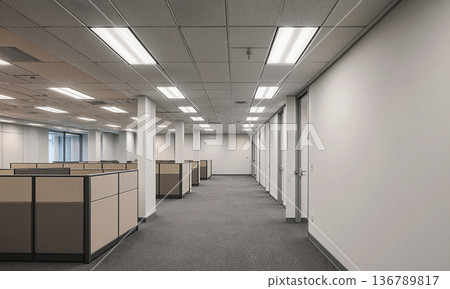 Office cubicle empty floor space inside a modern corporate building with fluorescent lighting and wide copy space for design 136789817