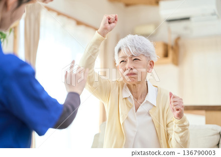Senior Asian woman assaults caregiver 136790003