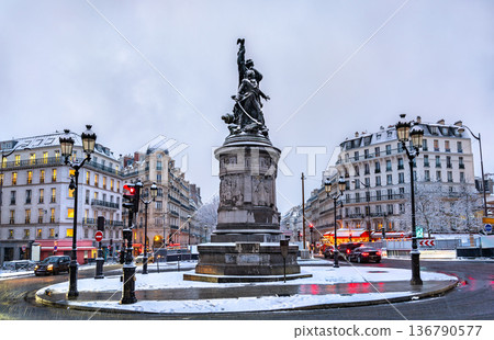 Snowy view of the Monument to Marshal Moncey at Place de Clichy in Paris, France. Features the bronze statue, classic buildings, and snow-covered streets on a winter day Snowy view of the Monument to Marshal Moncey at Place de Clichy in Paris, France. Features the bronze statue, classic buildings, and snow-covered streets on a winter day 136790577