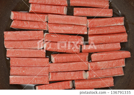 Frying Surimi Sticks in a Pan Frying Surimi Sticks in a Pan 136791335