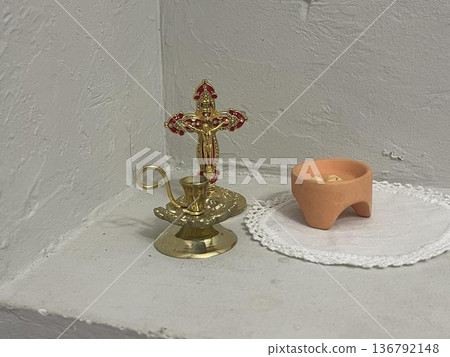 candlestick with candle in home altar 136792148