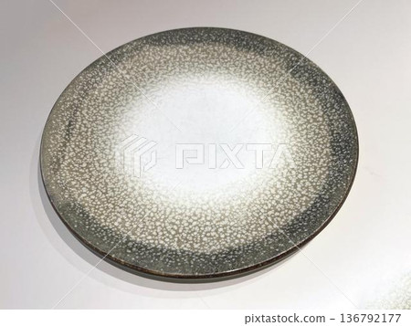 a plate on the white table a plate on the white table 136792177