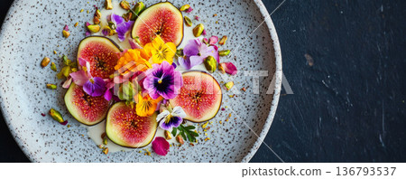 Fresh Figs with Edible Flowers and Pistachios on Ceramic Plate 136793537