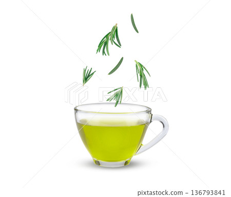 Fresh rosemary leaves sprinkled into rosemary tea, aromatic herbal drink with natural health benefits and refreshing scent white background. Fresh rosemary leaves sprinkled into rosemary tea, aromatic herbal drink with natural health benefits and refreshing scent white background. 136793841