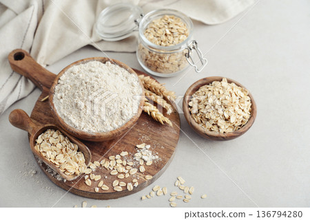 Oat flour in wooden bowl 136794280