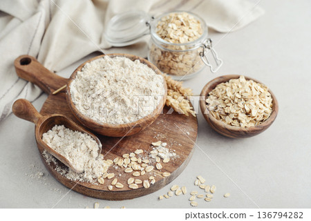 Oat flour in wooden bowl Oat flour in wooden bowl 136794282