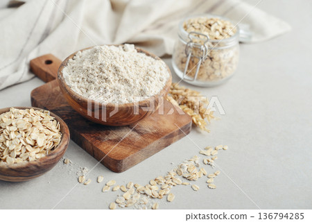 Oat flour in wooden bowl 136794285