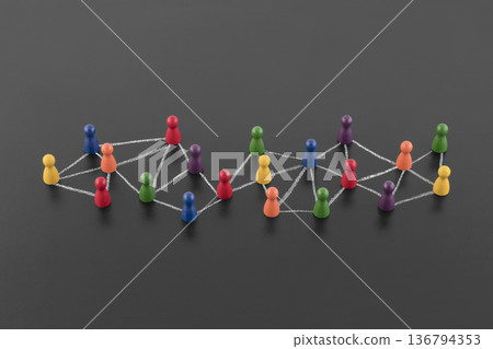 Colorful group of people figures connected with chalk on blackboard. Diversify people and social network concept 136794353