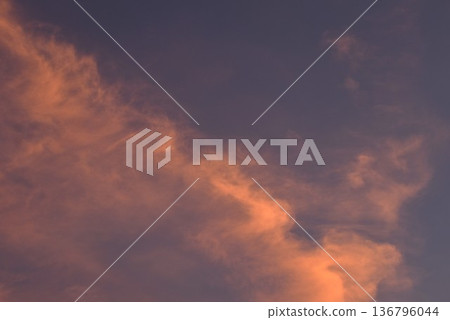 white and orange cloud spreading on twilight sunset blue sky in evening white and orange cloud spreading on twilight sunset blue sky in evening 136796044