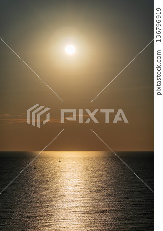 Beautiful red and orange sunrise over the sea. Beautiful red and orange sunrise over the sea. 136796919