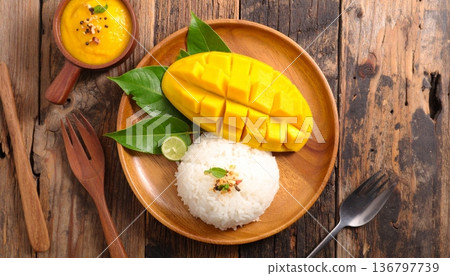 mango slice with sticky rice on the wooden table, top view mango slice with sticky rice on the wooden table, top view 136797739
