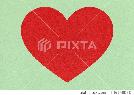 Red heart on light green paper texture background with copy space for Valentines Day banner, template or greeting card Red heart on light green paper texture background with copy space for Valentines Day banner, template or greeting card 136798038