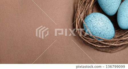 Easter Eggs In Nest. Minimalist Scene Featuring Blue Eggs In Rustic Natural Setting. Elegant Composition Showcasing Blue Speckled Eggs Nestled In Rustic Environment With Ample Space For Design 136799099