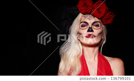 Woman With Sugar Skull Makeup And Red Roses. Mexican holiday Dia de los Muertos. Fashionable Stylish Bright Face Art, Deep Red Roses. Elegant Woman, Vibrant Makeup, Floral Patterns With Crimson Roses Woman With Sugar Skull Makeup And Red Roses. Mexican holiday Dia de los Muertos. Fashionable Stylish Bright Face Art, Deep Red Roses. Elegant Woman, Vibrant Makeup, Floral Patterns With Crimson Roses 136799101