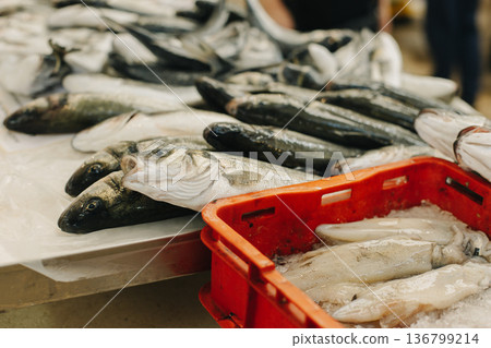 Fresh fish on ice at the traditional fish market. Fresh fish on ice at the traditional fish market. 136799214