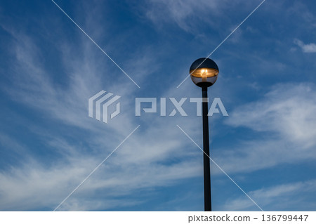 A landscape with blue sky and street lights at dusk A landscape with blue sky and street lights at dusk 136799447