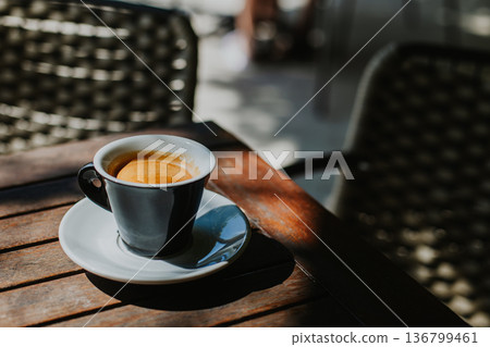 Cup of black coffee on a table in a street cafe. 136799461