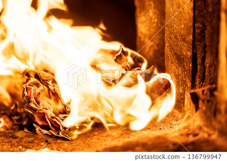 The instant the paper money burned fiercely inside the incense burner The instant the paper money burned fiercely inside the incense burner 136799947