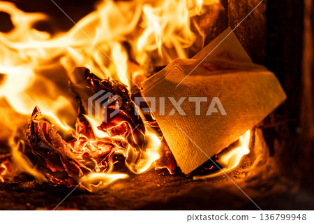 The instant the paper money burned fiercely inside the incense burner The instant the paper money burned fiercely inside the incense burner 136799948