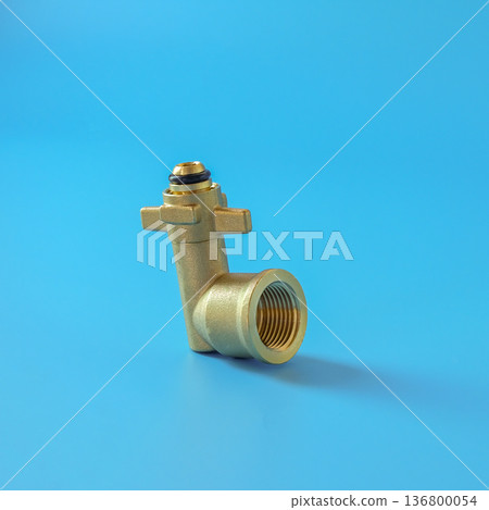 Brass fittings for gas cylinders on color background. Brass fittings for gas cylinders on color background. 136800054