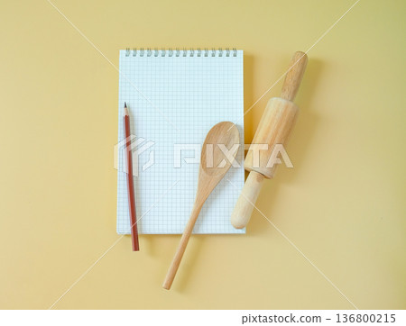 Blank recipe book with rolling pin and spoon. Blank recipe book with rolling pin and spoon. 136800215