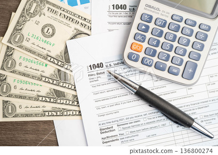 Bangkok, Thailand - May 15, 2022 Tax form 1040 U.S. Individual Income Tax Return, business finance. Bangkok, Thailand - May 15, 2022 Tax form 1040 U.S. Individual Income Tax Return, business finance. 136800274