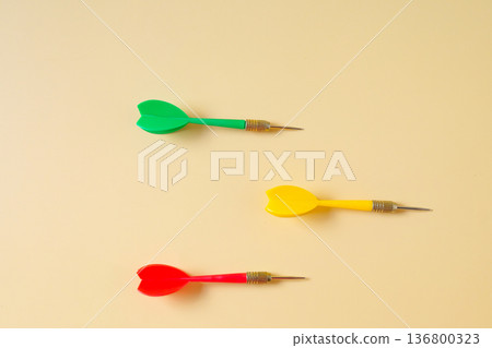 Colorful plastic darts arrow on color background. 136800323