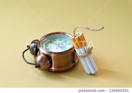 A cigarettes binding with a cord looks like a dynamite. A cigarettes binding with a cord looks like a dynamite. 136800361