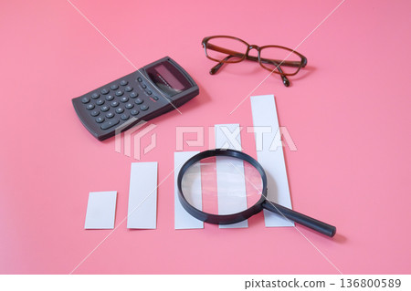 A magnifying glass with charts graphic bar. Financial development. A magnifying glass with charts graphic bar. Financial development. 136800589