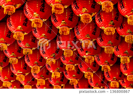 Numerous red lanterns were neatly hung from the temple ceiling. Numerous red lanterns were neatly hung from the temple ceiling. 136800867
