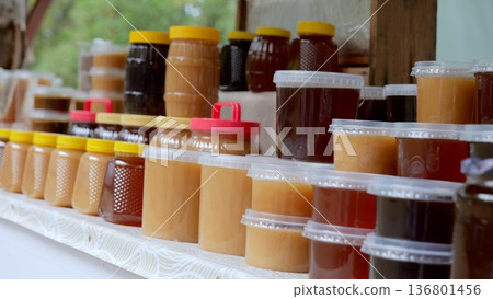 Sweet breakfast storage, Sunlit display of spread jars in kitchen, Neat collection of honey and spreads on windowsill, Wellarranged jars of sweet spreads and honey create cozy kitchen Sweet breakfast storage, Sunlit display of spread jars in kitchen, Neat collection of honey and spreads on windowsill, Wellarranged jars of sweet spreads and honey create cozy kitchen 136801456