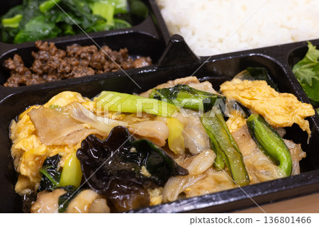 Delicious Chinese bento with fried pork and eggs Delicious Chinese bento with fried pork and eggs 136801466