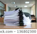 A large amount of documents piled up on a desk | Image of office work 136802300