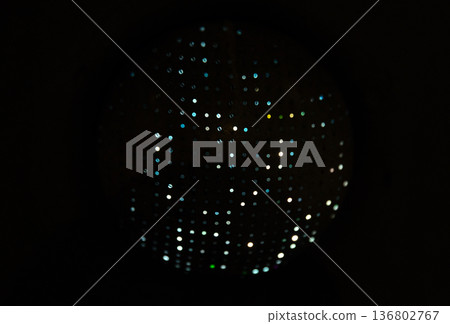 Abstract photo of a circular panel covered in uniform tiny dots 136802767