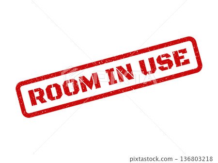 Distressed red rubber stamp displaying the message of an occupied area 136803218