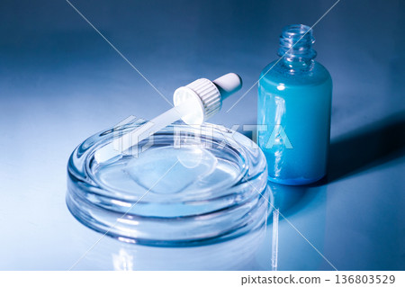 Blue Copper peptides skin repairing serum in transparent bottle. Face and skin beauty routine themes 136803529