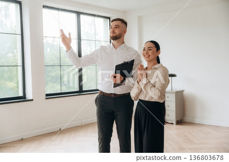 Man and woman are in the modern new room, conception of business 136803678