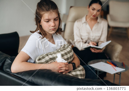 Feeling depressed. Girl at a psychologist's appointment Feeling depressed. Girl at a psychologist's appointment 136803771