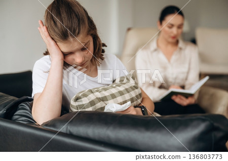 Don't want to talk, feeling depressed. Girl at a psychologist's appointment Don't want to talk, feeling depressed. Girl at a psychologist's appointment 136803773