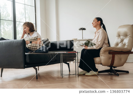 Don't want to talk, feeling depressed. Girl at a psychologist's appointment Don't want to talk, feeling depressed. Girl at a psychologist's appointment 136803774