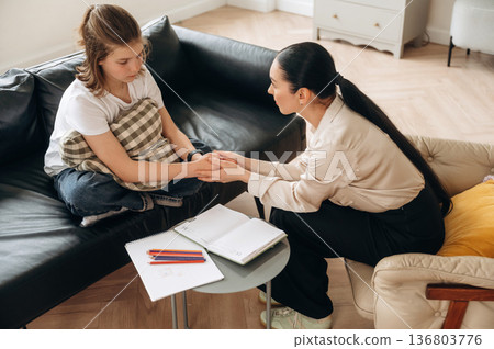 Girl at a psychologist's appointment Girl at a psychologist's appointment 136803776