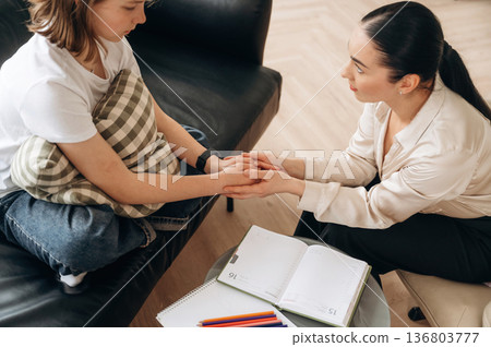 Girl at a psychologist's appointment Girl at a psychologist's appointment 136803777