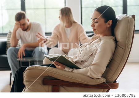Arguing, feeling bad. Couple are at psychologist appointment Arguing, feeling bad. Couple are at psychologist appointment 136803792