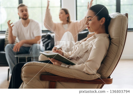 Arguing, feeling bad. Couple are at psychologist appointment Arguing, feeling bad. Couple are at psychologist appointment 136803794