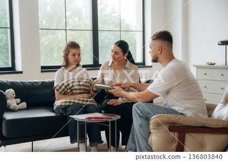 Having the conversation. Mother with her daughter are at psychologist appointment 136803840