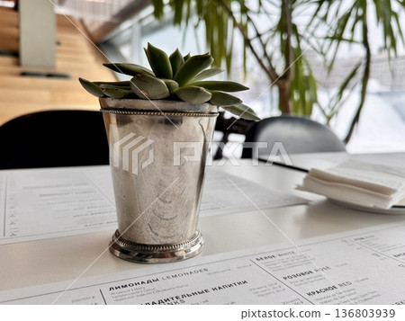 Beautiful flower arrangement in a cafe Beautiful flower arrangement in a cafe 136803939