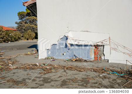 Broken Beach House Wall with Storm Debris Broken Beach House Wall with Storm Debris 136804030