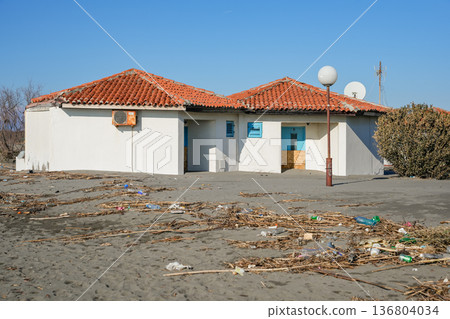 Beach Houses with Storm Debris on Shore 136804034